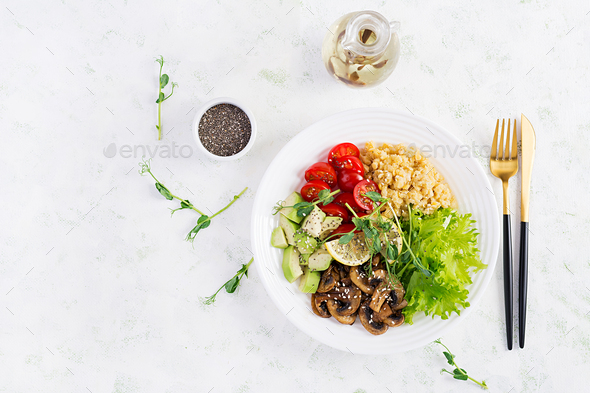 Vegan Buddha bowl with lentil, avocado, mushrooms, lettuce, tomatoes - Stock Photo - Images