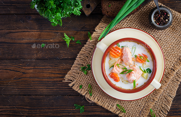 Creamy soup with salmon, potatoes, onions and carrots and in a bowl. - Stock Photo - Images