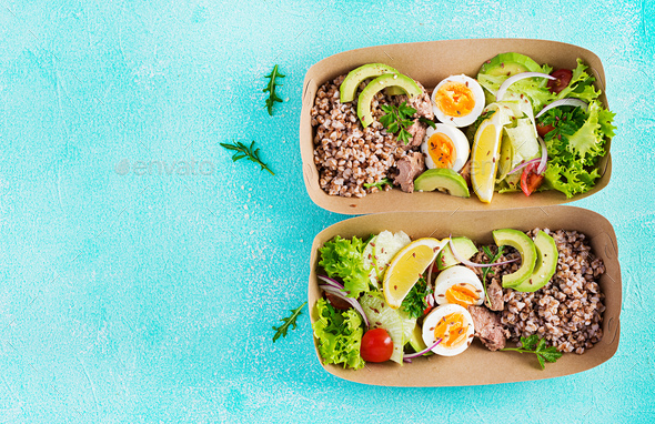 Buckwheat porridge, sliced tuna, boiled egg and fresh vegetable salad - Stock Photo - Images