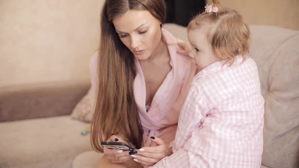 Mom Treating Child During Illness and Showing Cartoons