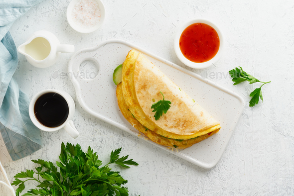 Trendy breakfast with quesadilla and eggs, trending food with omelet, cheese - Stock Photo - Images