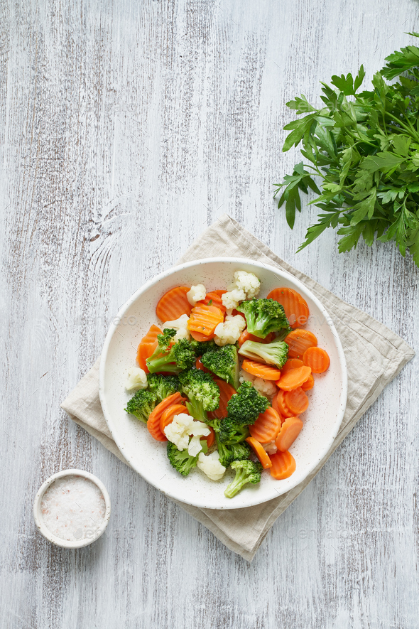 Mix of boiled vegetables. Broccoli, carrots, cauliflower. Steamed vegetables - Stock Photo - Images