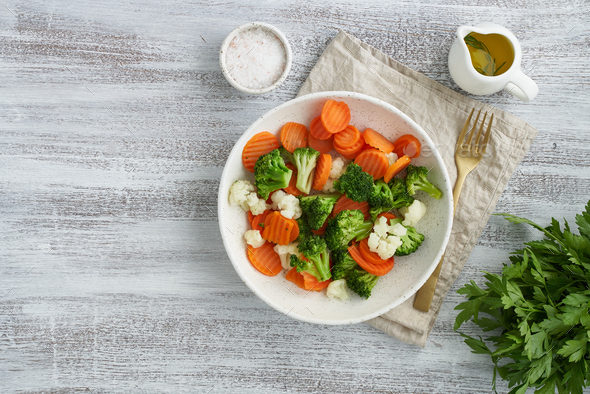 Mix of boiled vegetables. Broccoli, carrots, cauliflower. Steamed vegetables - Stock Photo - Images