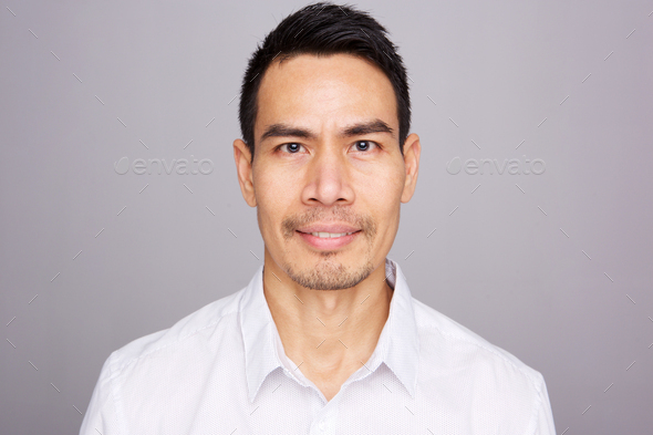 Close up of middle aged asian man Stock Photo by mimagephotography