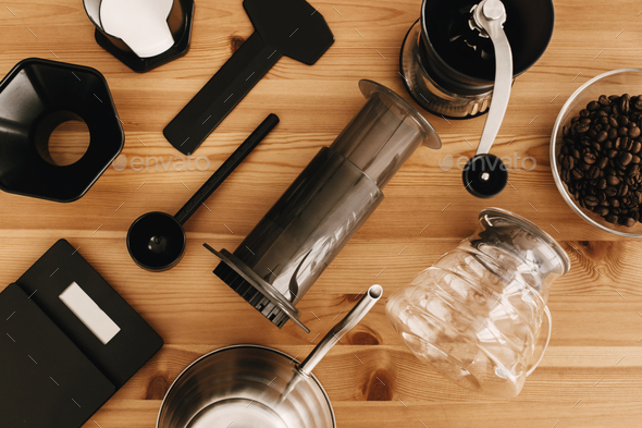 Professional barista preparing coffee in aeropress Stock Photo by Sonyachny