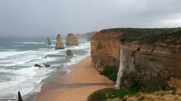 Australia's Iconic Twelve Apostles With Rare Waterfall After Heavy Rain alt
