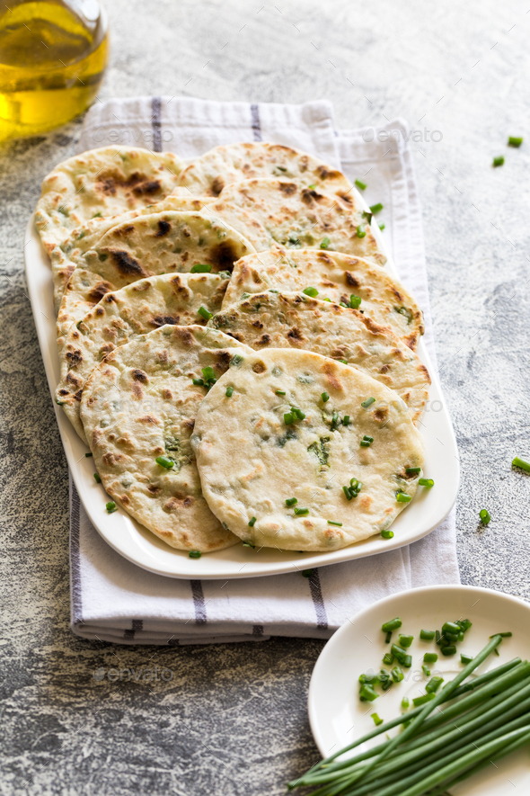 Onion naan - traditional indian bread. pita bread Stock Photo by Ivannag82