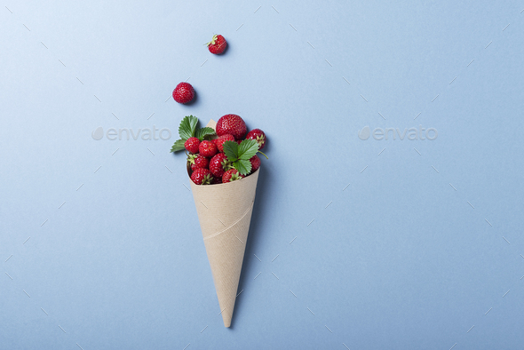 Sweet fresh strawberry into paper cone - Stock Photo - Images