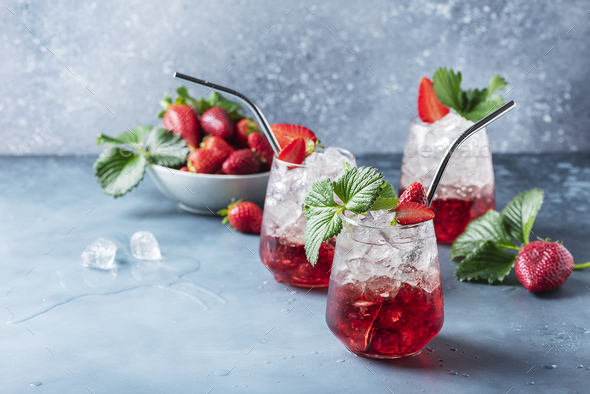 Red cocktail with ice and fresh strawberry - Stock Photo - Images
