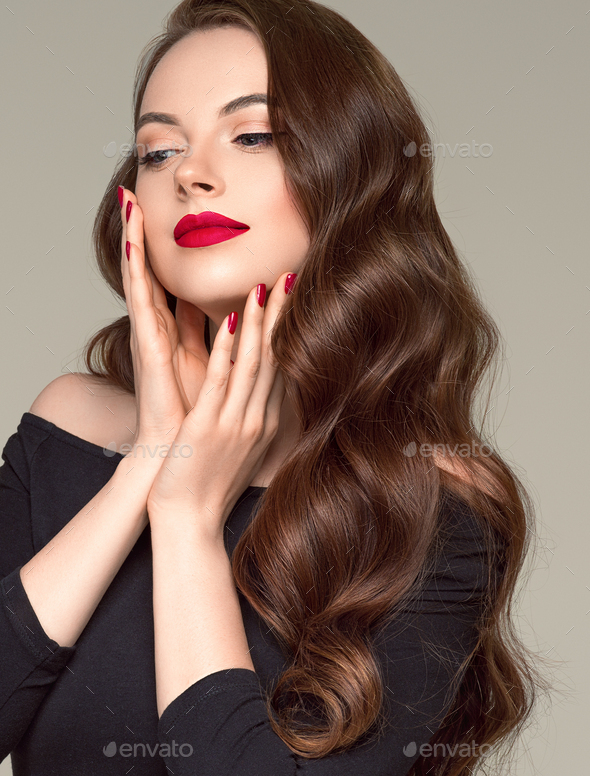 Red lipstick woman beauty hair close up face fashion portrait manicured  hands Stock Photo by kiraliffe