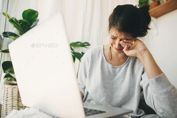 Young woman worries about losing job, depression - Stock Photo - Images