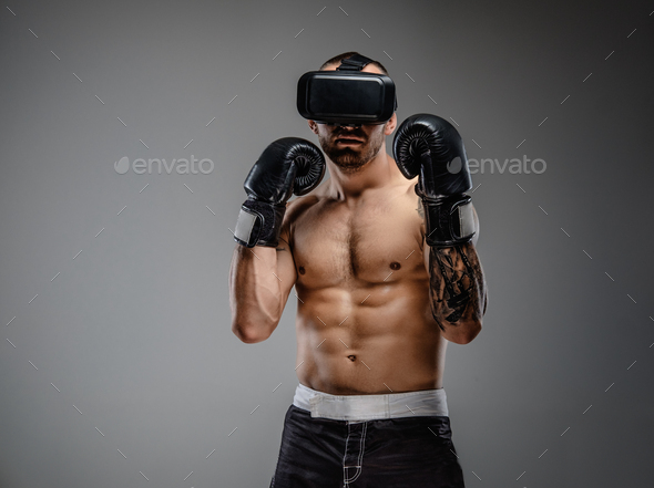 Shirtless brutal boxing fighter in virtual reality glasses. - Stock Photo - Images