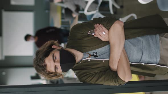 Vertical Portrait of Man in Office during Pandemic alt