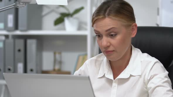 Tired Female Entrepreneur Yawning in Office During Extra Hours, Overworking