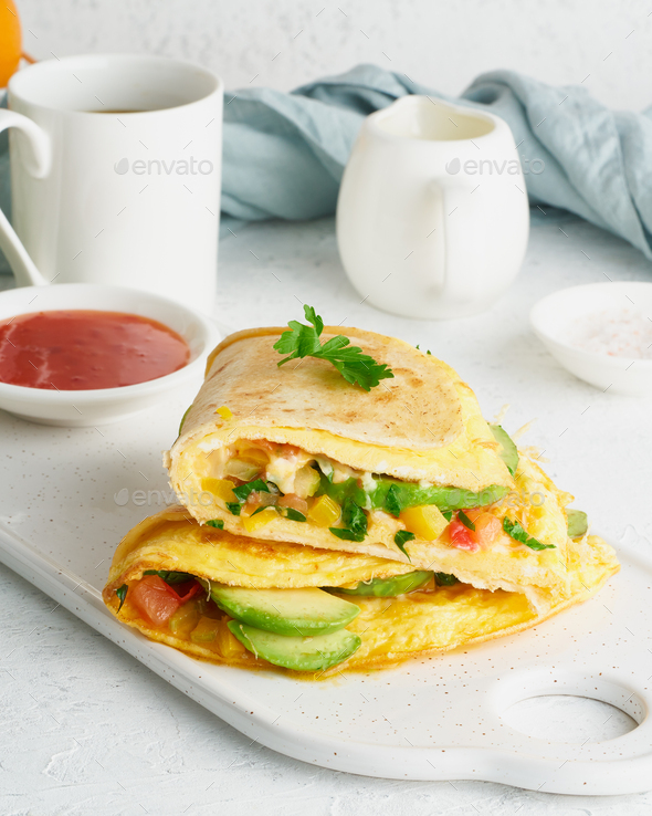 Trendy breakfast with quesadilla and eggs, trending food with omelet, cheese