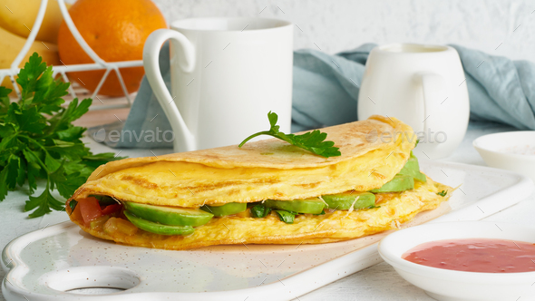 Trendy breakfast with quesadilla and eggs, trending food with omelet, cheese - Stock Photo - Images
