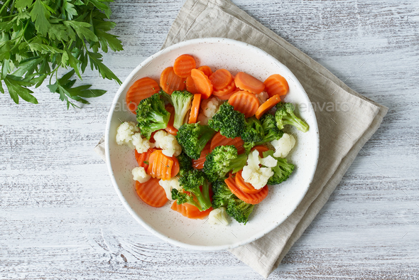 Mix of boiled vegetables. Broccoli, carrots, cauliflower. Steamed vegetables - Stock Photo - Images