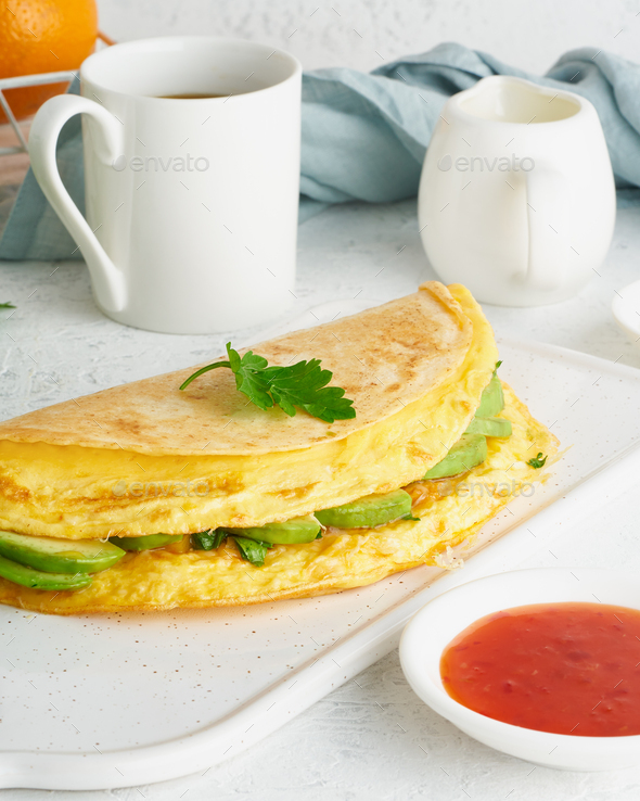 Trendy breakfast with quesadilla and eggs, trending food with omelet, cheese