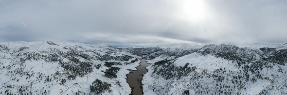 Aerial view of winter lake in snowy mountains - Stock Photo - Images