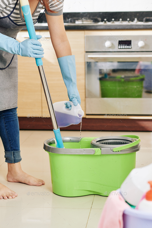 Housewife Pouring Floor Cleaning Liquid Stock Photo - Image of