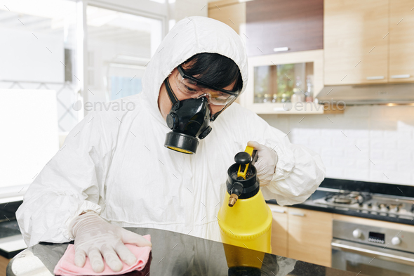 Specialist applying antibacterial spay - Stock Photo - Images