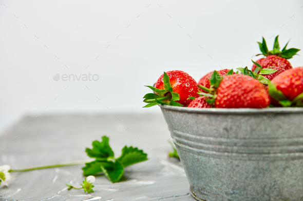 Strawberries in grey bowl. Fresh strawberries. Beautiful strawberries. - Stock Photo - Images