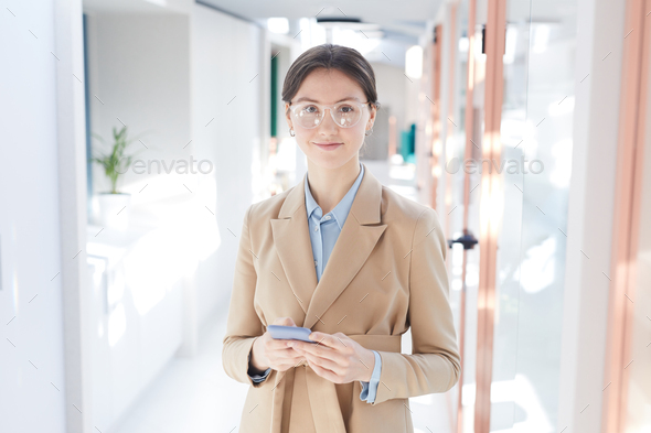 Elegant Young Businesswoman in Office Hall - Stock Photo - Images
