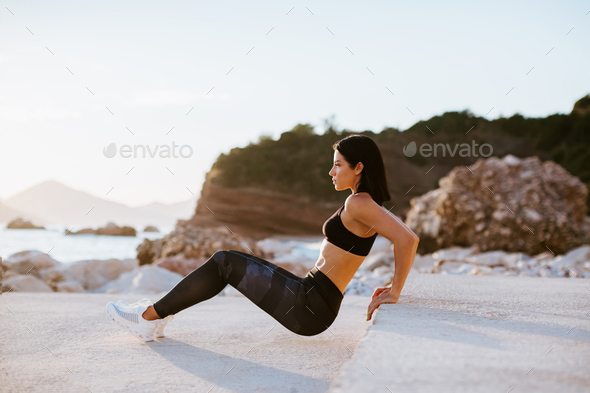beautiful athletic woman working out outdoors - Stock Photo - Images