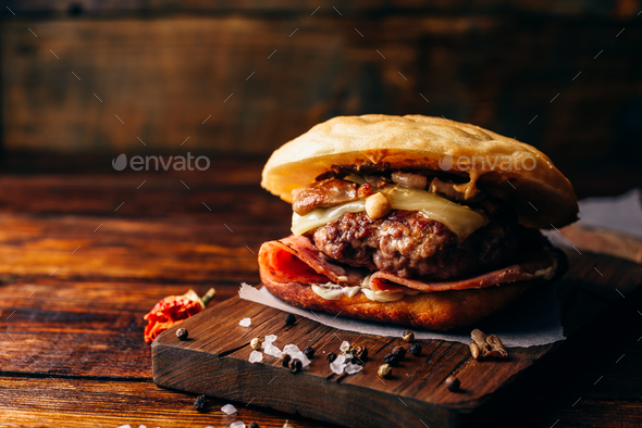 Cheeseburger on Cutting Board - Stock Photo - Images