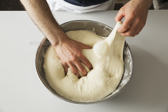 Close Up Of A Baker Kneading Bread Dough In A Metal Mixing Bowl High-Res  Stock Photo - Getty Images