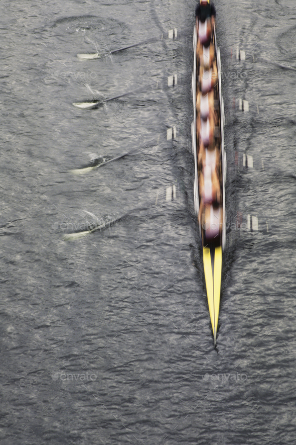 Overhead view of men rowing scull boat during competition on the water off shore in Seattle.