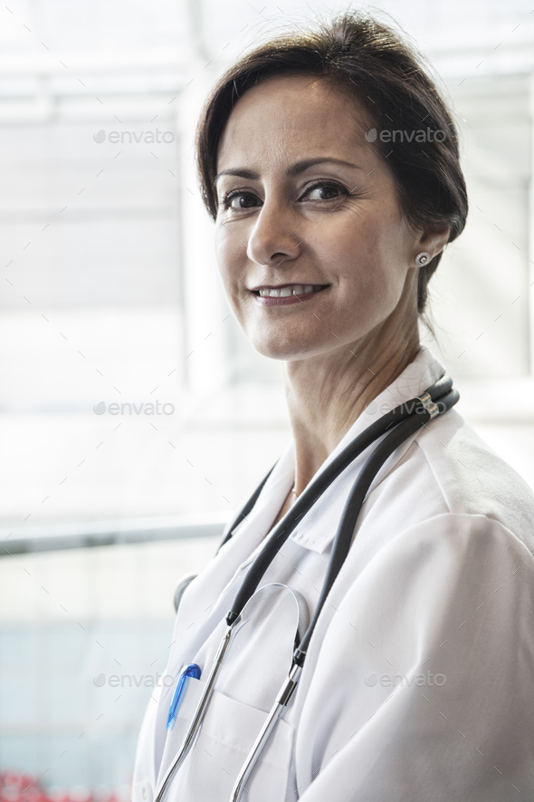 Download Caucasian female doctor in lab coat with stethescope. Stock Photo by Mint_Images