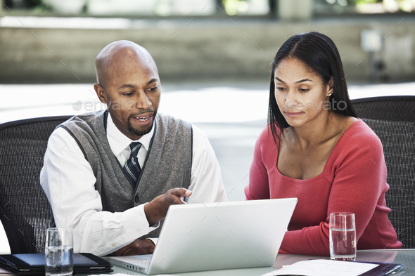 Black Business Man And Mixed Race Caucasian Woman In A Business Center ...