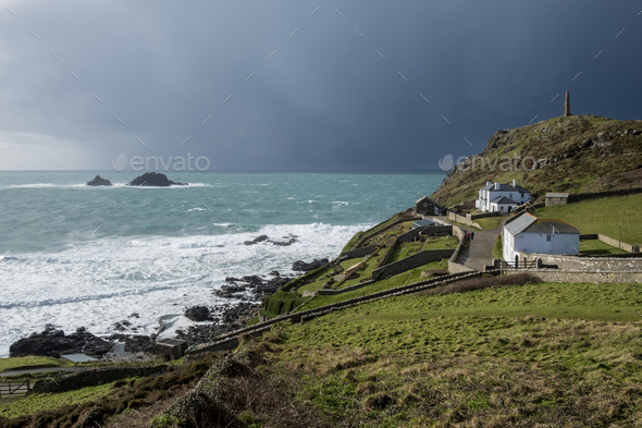 Cot Valley, St Just, West Cornwall coastline. View of cottages overlooking the coast and the Brisons - Stock Photo - Images