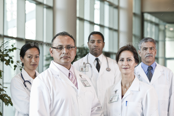 Mixed race group of doctors in lab coats.