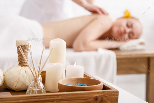 Ayurvedic massage. Bags with herbs, salt and aromatic sticks, close up