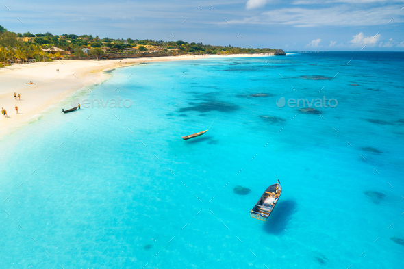 Aerial view of the fishing boats on tropical sea coast - Stock Photo - Images