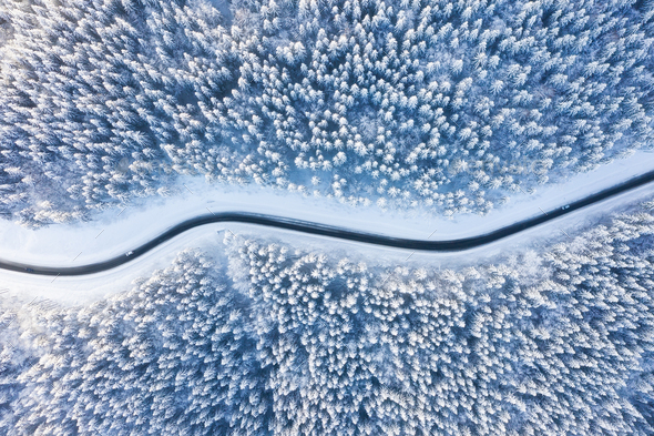 Road and winter forest from air. Winter aerial landscape. View from drone - Stock Photo - Images