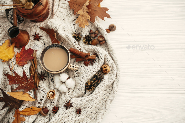 Autumn flat lay, cozy inspirational image.Hygge lifestyle. Coffee cup with fall leaves - Stock Photo - Images