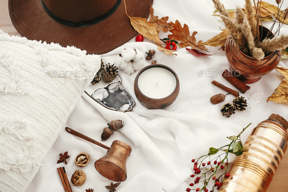 Autumn mood. Candle, berries, fall leaves. Hygge lifestyle - Stock Photo - Images