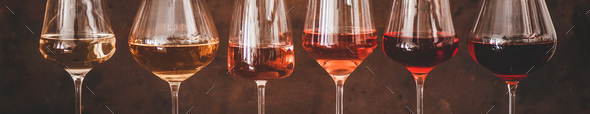 Shades of Rose wine in glasses, rusty background, wide composition - Stock Photo - Images