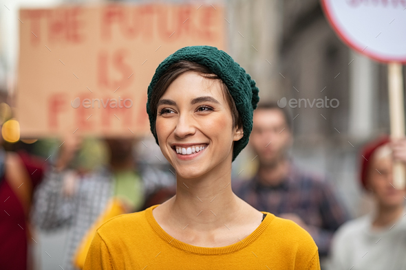 Happy smiling woman in protest for female rights - Stock Photo - Images