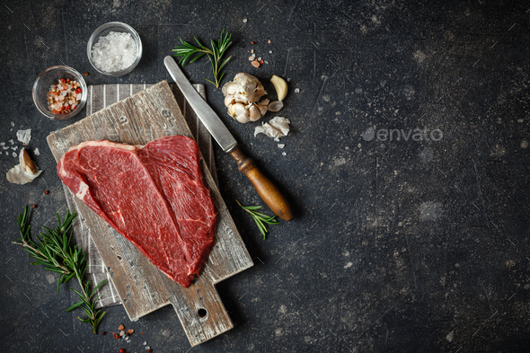 Raw beef steak with spices. - Stock Photo - Images