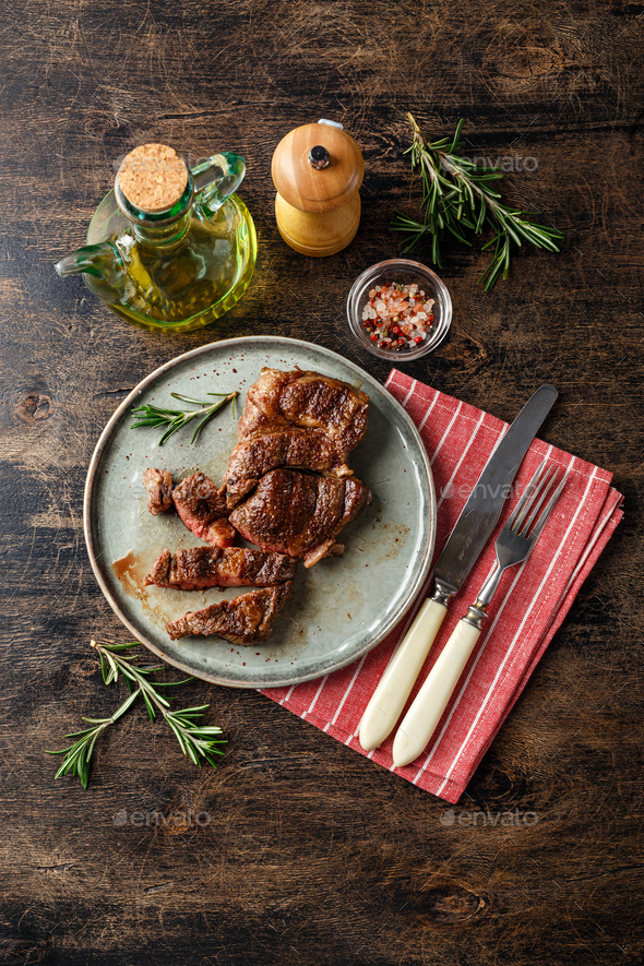 Two beef steak on dark gray background Stock Photo by Irrin | PhotoDune