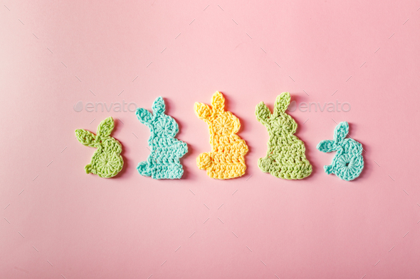 Easter decoration, bunny rabbits made of crochet colorful yarn. Homemade decor. - Stock Photo - Images