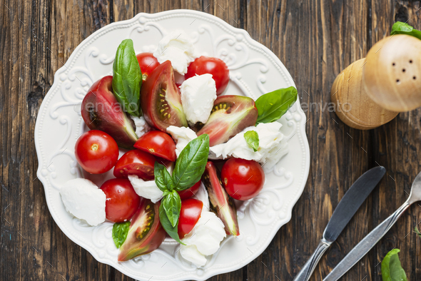 Italia salad caprese with tomato, basil and mozzarella - Stock Photo - Images