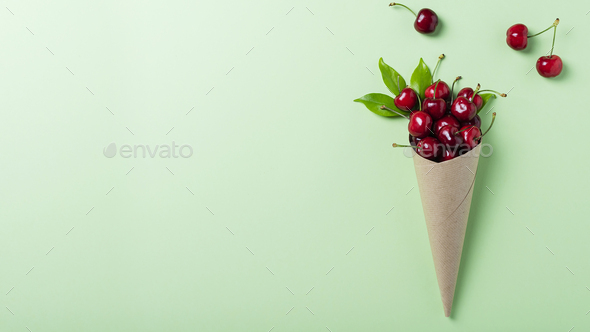 Sweet fresh cherry into paper cone - Stock Photo - Images