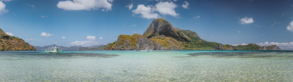 Ultra wide banner of El Nido bay with trip boat and Cadlao island, Palawan, Philippines. Panoramic