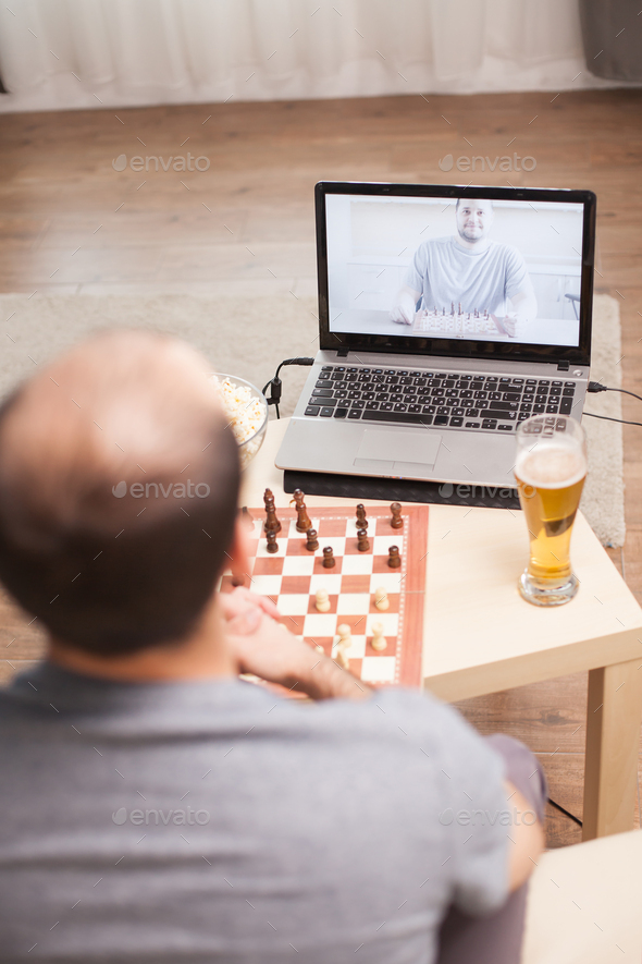 Young Man Playing Game of Chess Online with Friend, Stock Video - Envato  Elements