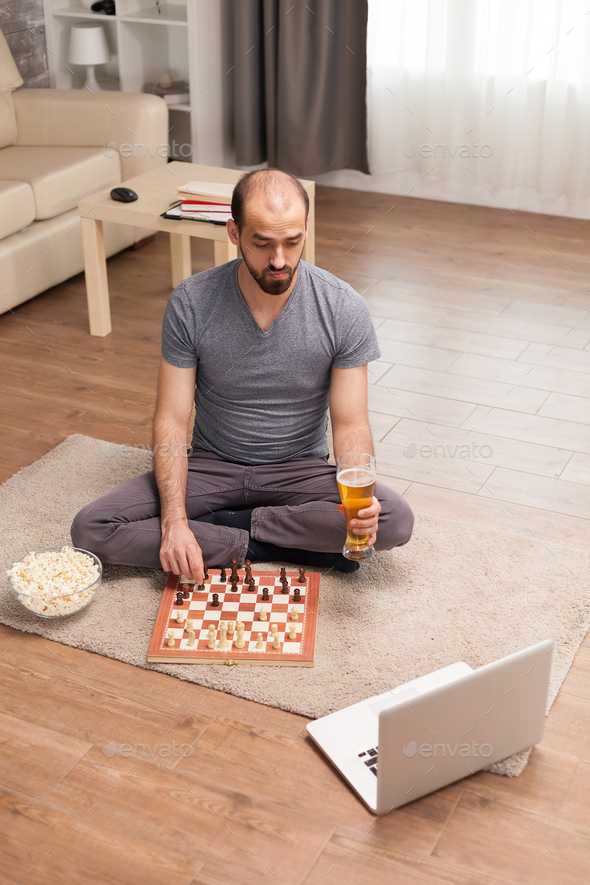 Young Man Playing Game of Chess Online with Friend, Stock Video - Envato  Elements